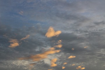 Blue sky and white heart-shaped clouds at sunset, evening, taking pictures blurred