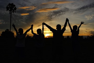 Children travel adventures in the jungle with fun, golden yellow light at sunset