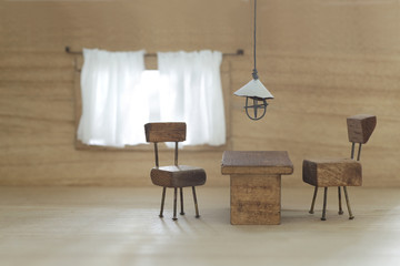小さな椅子とテーブルとライトと窓のミニチュアジオラマ風インテリア
