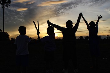 Children travel adventures in the jungle with fun, golden yellow light at sunset