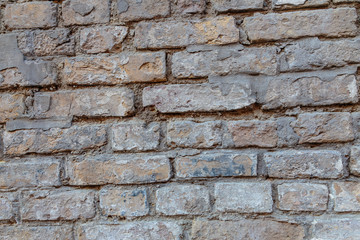 A rock. Brick wall. Background. Close-up.
