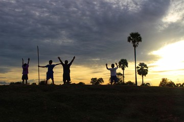 Children travel adventures in the jungle with fun, golden yellow light at sunset
