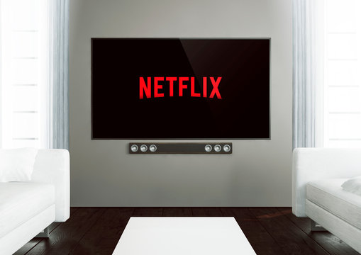 wooden living room with smart tv showing netflix