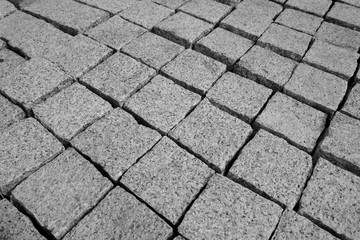 Granite stones for natural stone paving in the building materials trade for sale, close-up