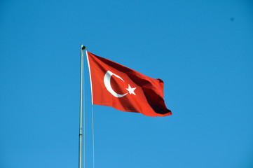 National state symbols. Flag of Turkey on a background of sky.