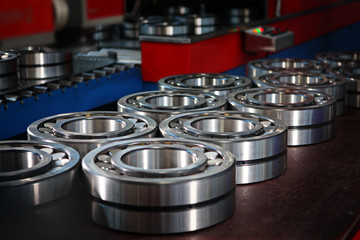 Finished products bearings in production after the conveyor. The glossy surface of steel products....