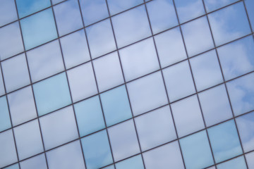Multiple office windows background with sky reflection