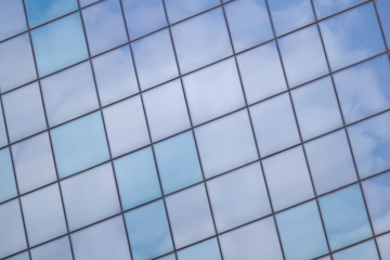 Fototapeta premium Multiple office windows background with sky reflection
