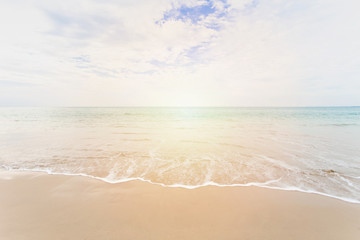 Fototapeta na wymiar Sea and sand with wave on blue sky background with copy space.