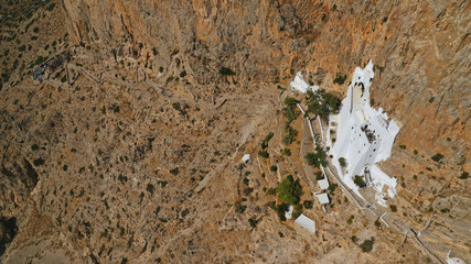 Aerial drone photo of breathtaking whitewashed holy Monastery of Panagia Hozoviotissa built in a...