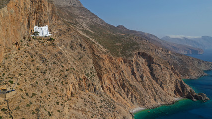 Aerial drone photo of breathtaking whitewashed holy Monastery of Panagia Hozoviotissa built in a...