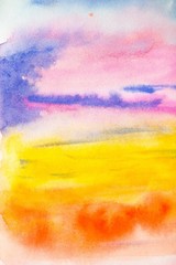Bright watercolor background with different rainbow colors, resembles a sunset in the sky, the setting sun and multi-colored clouds. Background for design, cards, paper.