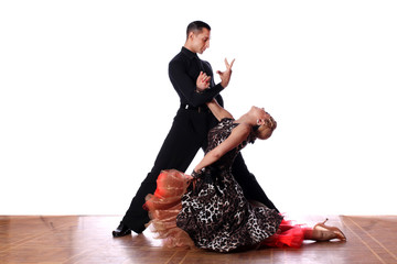 Latino dancers in ballroom against white background