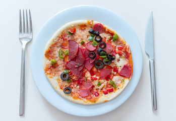 homemade pizza on white plate