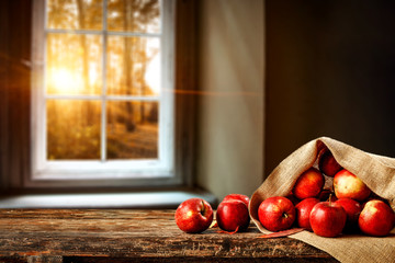Fresh red apples and window sill background 