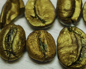 ugly but gold,  coffee beans golden-painted on a table