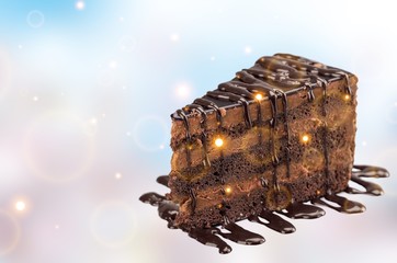 Chocolate cake with chocolate creamy on blurred background