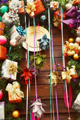 Fototapeta premium colorful wooden background with multicolored gift box and balls. decorations for xmas and New Year