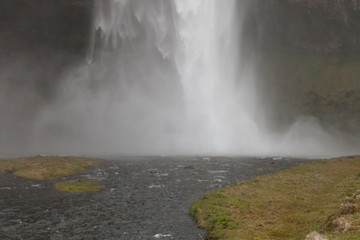 Famous Iceland waterfalls with a clean water on a stony rocky mountain landscape