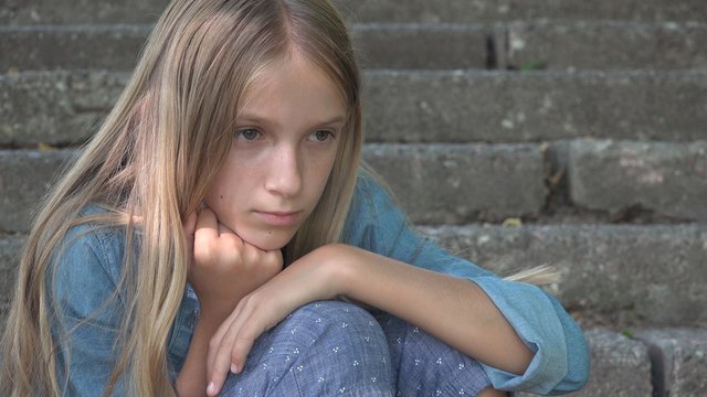 Sad Child, Not Playing Alone Kid, Unhappy Thoughtful Girl in Outdoor in Park