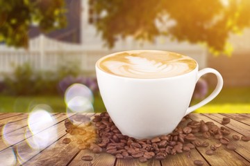 Flat white coffee with grains on wooden table