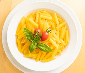 Dish with macaroni tomato and basil