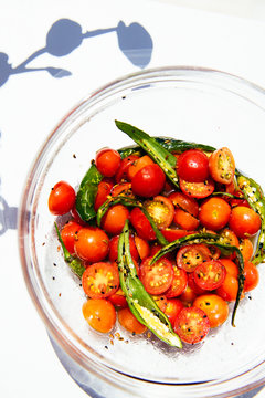 Cherry Tomatoes and Chili Peppers in Glass Bowl