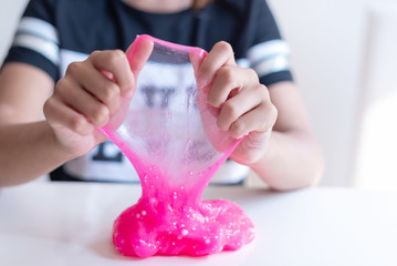 child play with hand made toy called slime