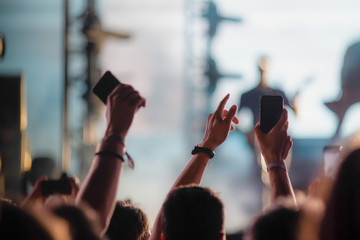 crowd of people having fun at concert - summer music festival
