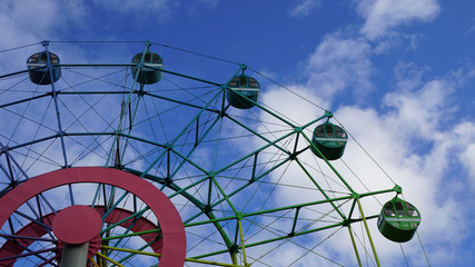 Ferris wheel and blue sky in the amusement park