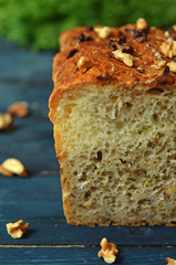Bread with nuts on a wooden background
