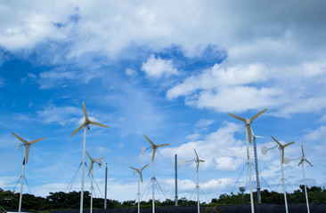 Wind generators standing in farmland