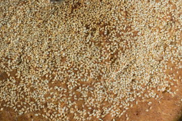 Freshly baked whole grain homemade bread and sesame full frame