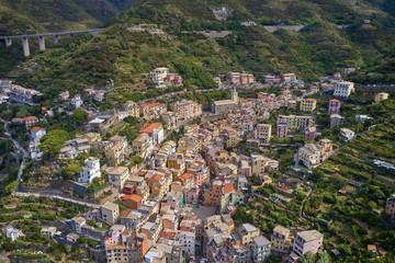 Panorama view of Corniglia village one of Cinque Terre in La Spezia, Italy. Flight by a drone.