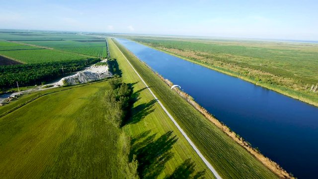 Flying above a paraglider gliding alongside Lake Okeechobee in Southern Florida