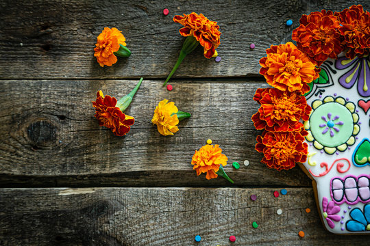 Day of the dead concept dia de los muertos - skull shapes cookie with  marigold flowers, top view Stock Photo