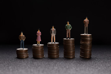 Miniature people: Group of small businessmen standing on coin with  Business Growth concept.