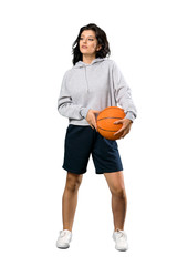 Young woman playing basketball