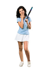 A full-length shot of a Young tennis player woman with surprise facial expression over isolated white background