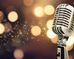 Retro style microphone on blurred background