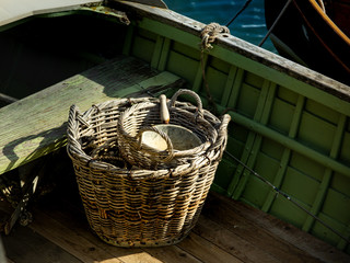 Basket and sieve on a fishing boat