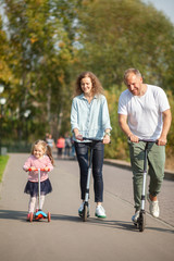 Family on scooters