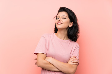 Fototapeta premium Young woman over isolated pink background laughing