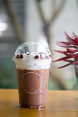 Mocha iced coffee with empty circle label on a glass