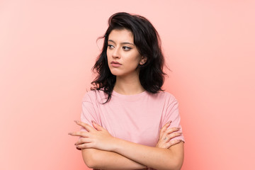 Fototapeta premium Young woman over isolated pink background thinking an idea