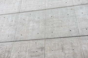 Wall of dark gray concrete blocks