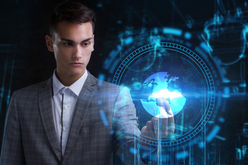 The concept of business, technology, the Internet and the network. A young entrepreneur working on...