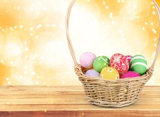 Easter basket filled with colorful eggs