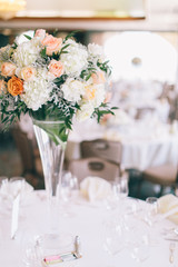 Fine wedding flower table arrangement at reception, pink, white and orange peonies, expensive wedding flowers