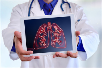 Doctor showing lungs on a tablet in front closeup